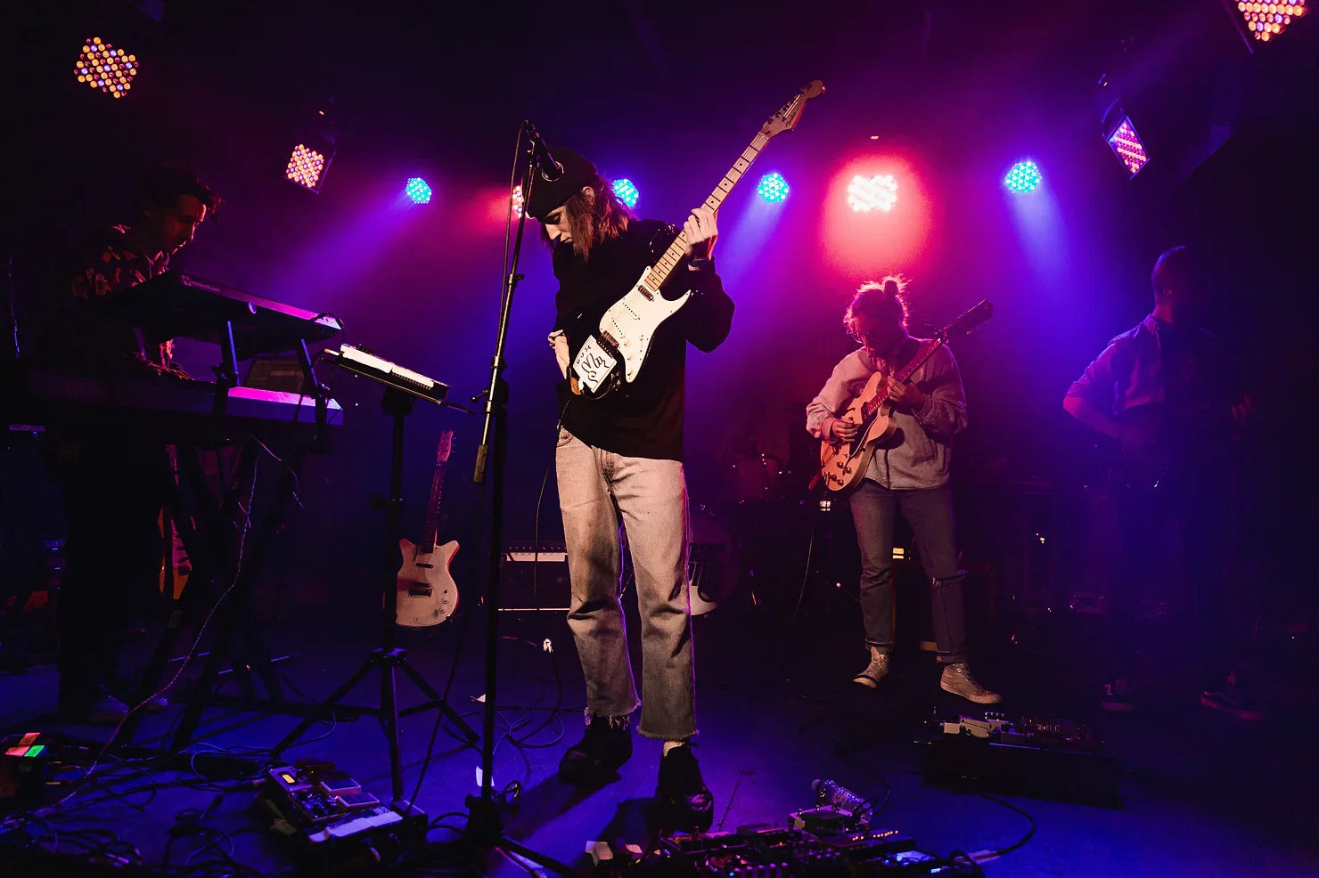 a guitarist on stage about to perform live